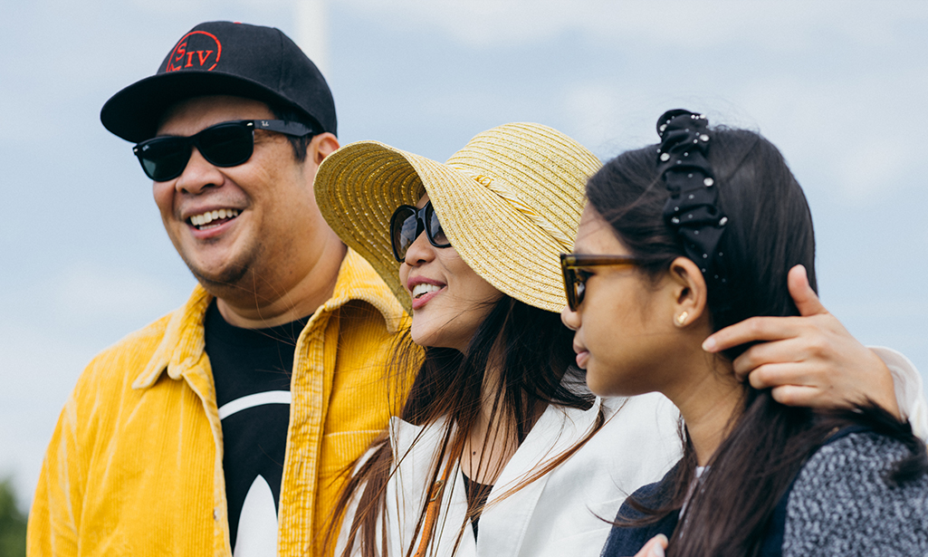 Allen and Kathleen Damasco outdoors with their daughter Ylisha. 